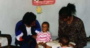 Nurse Wogeyahu Hailimariam with the child and another nurse in Ethiopia